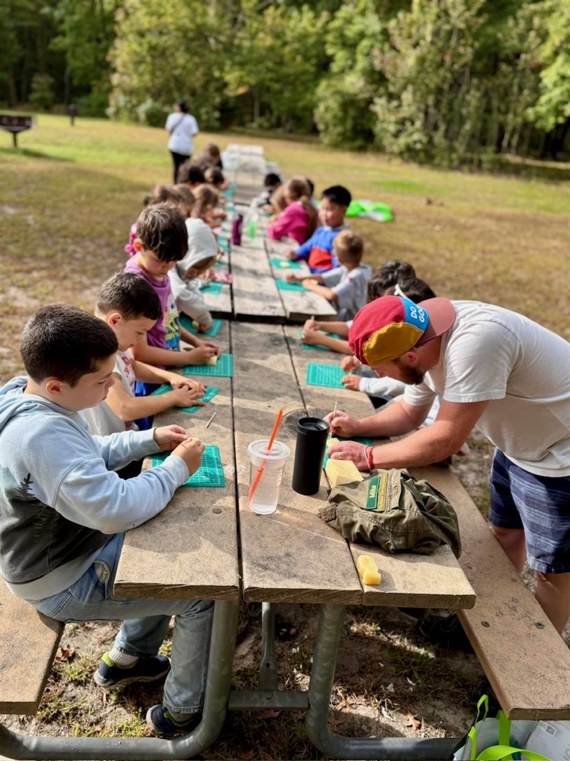 Scouts working on a craft skill