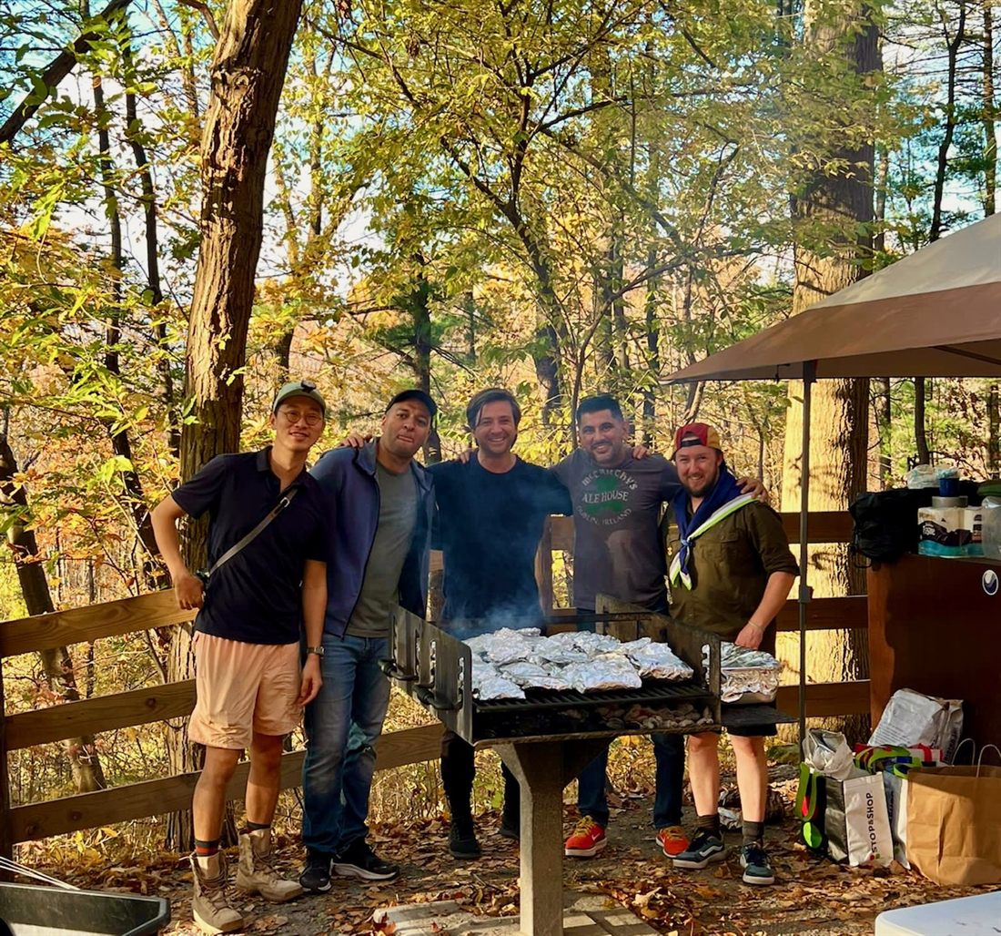 Leaders grilling at a camp cookout