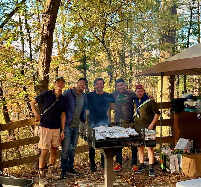 Leaders grilling at a camp cookout