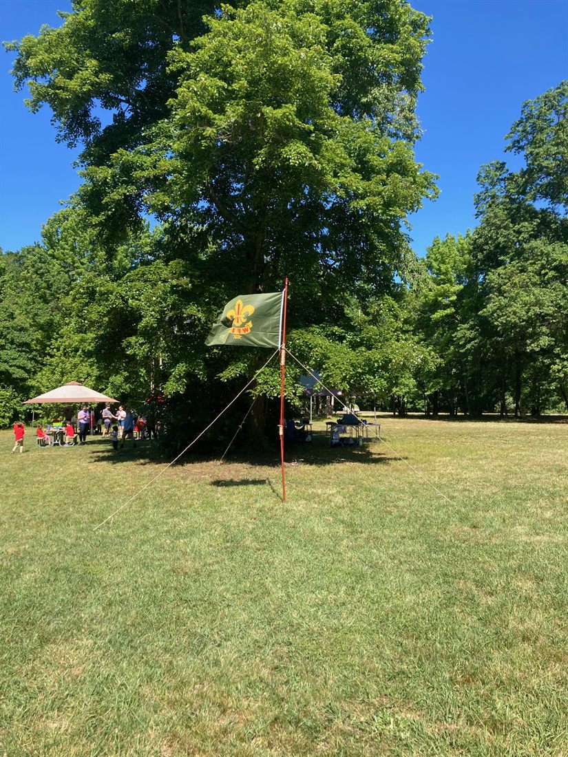 An Outdoor Service Guides flag flying at camp